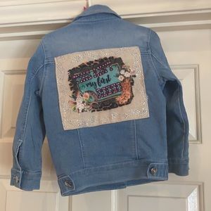 Cute sequined denim jacket with pockets. Back:  “This ain’t my first rodeo.” XS